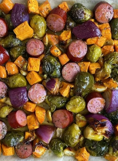 Sheet pan meal featuring Maple Dijon Sausage and colorful roasted veggies