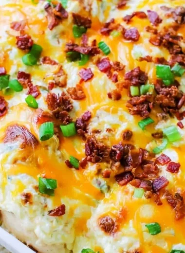 Creamy Million Dollar Chicken Bake topped with jalapenos and ranch dressing