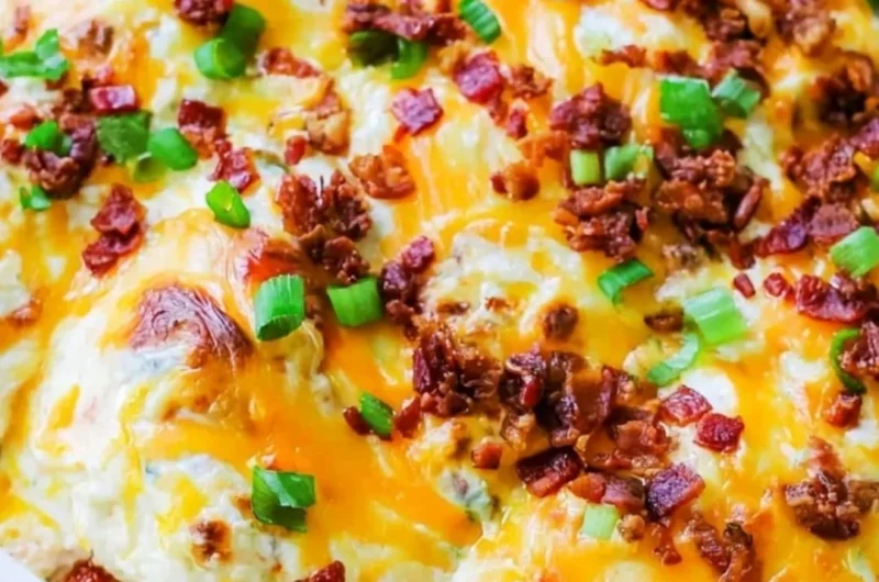 Creamy Million Dollar Chicken Bake topped with jalapenos and ranch dressing