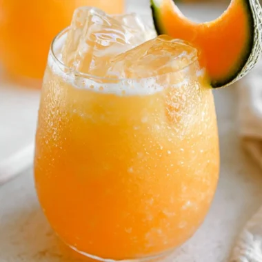 A refreshing glass of homemade Pineapple Water with fresh pineapple slices.