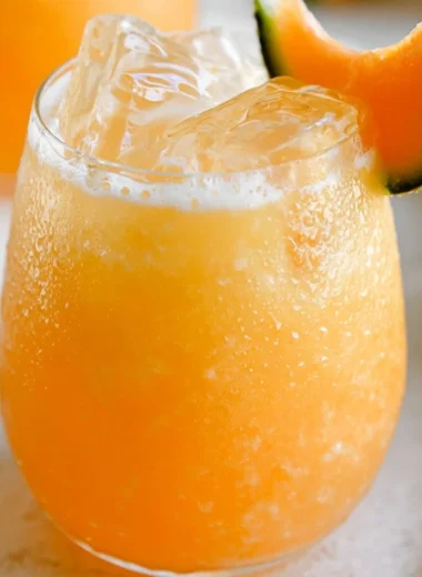 A refreshing glass of homemade Pineapple Water with fresh pineapple slices.