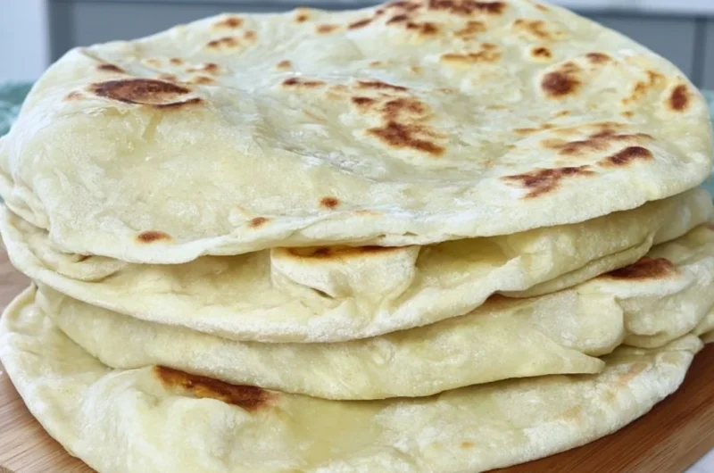 Homemade sourdough discard tortillas on a wooden surface