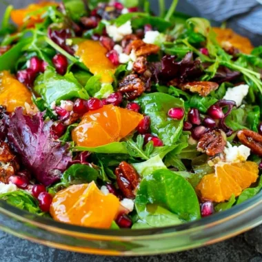 Colorful Christmas salad with seasonal ingredients for festive occasions.