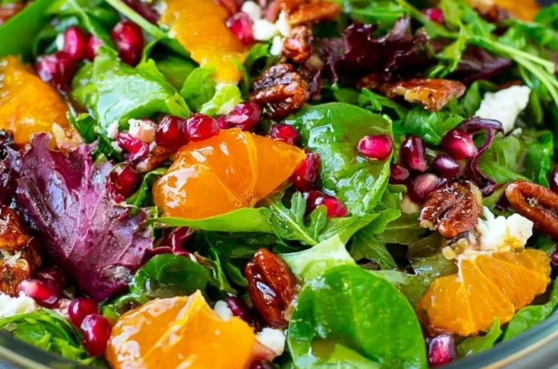 Colorful Christmas salad with seasonal ingredients for festive occasions.
