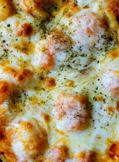 Delicious cheesy gnocchi casserole served in a baking dish