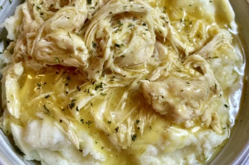 Delicious slow cooker chicken and gravy served with mashed potatoes